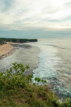 View from above of ocean coast at Bali island, Indonesia