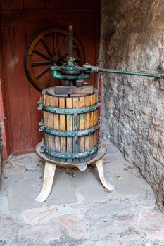 ancient press for crushing grapes for the production of wine