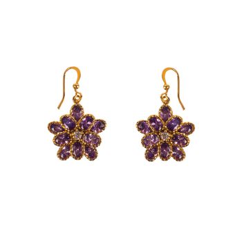 Golden earrings with purple gems isolated on white