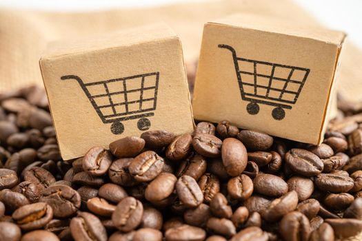 Box with shopping cart logo symbol on coffee beans, Import Export Shopping online or eCommerce delivery service store product shipping, trade, supplier concept.