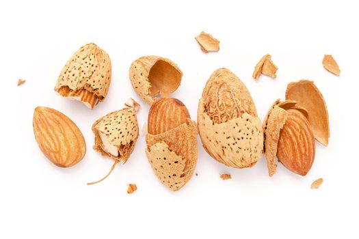 Close up group of almonds nut with shell  and cracked almonds shell isolated on white background.