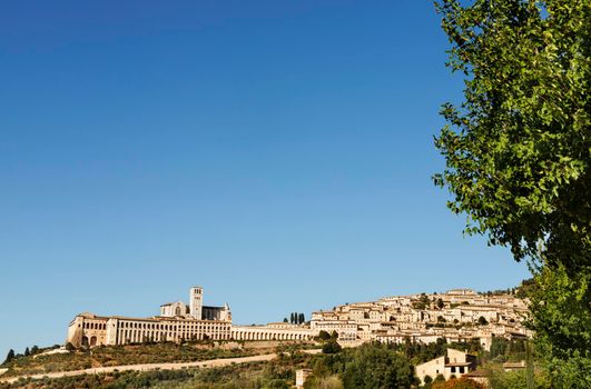 View of Assisi  on Monte Subasio ,Italy , with Basilica of San Francesco and medieval houses