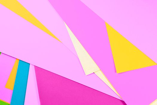 Sheet of multicolored paper background , yellow , pink , blue and purple 