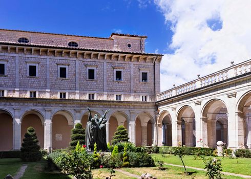 Montecassiono Abbey - Italy -August 29 -2021 -cloister with bronze sculpture , 