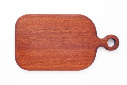 Empty vintage wooden cutting board isolated on white background top view.