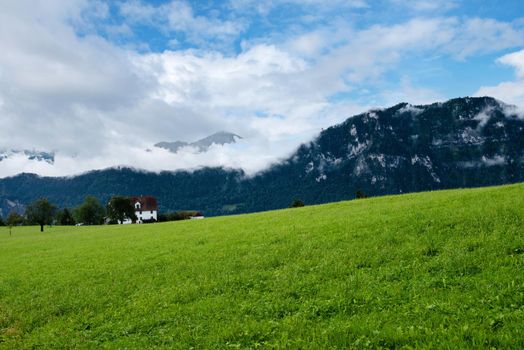 Beautiful green mountains landscape in Switzerland Alps.