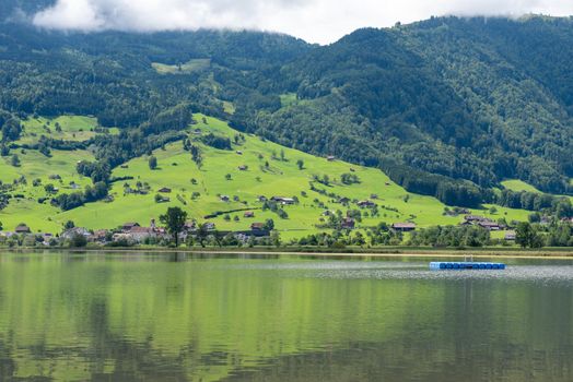 A calm place to rest and relax in Lake Lauerz, Switzerland. Panorama view
