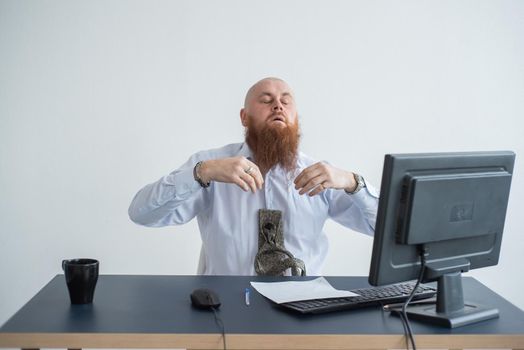 Problems for the office worker. A bald man in a white shirt sits at a desk with a computer and is stressed because of failure. A nervous breakdown