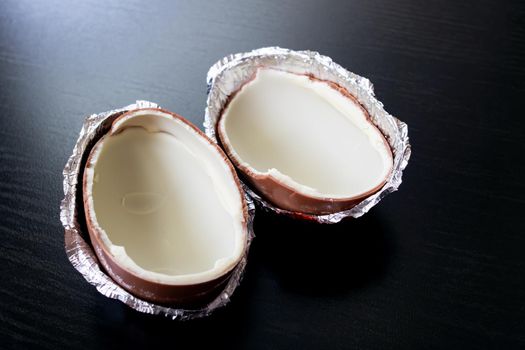 BELARUS, NOVOPOLOTSK - AUGUST 25, 2020: Two half of chocolate egg kinder surprise close up
