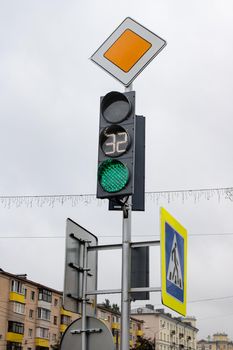 Green light at a traffic light in the city