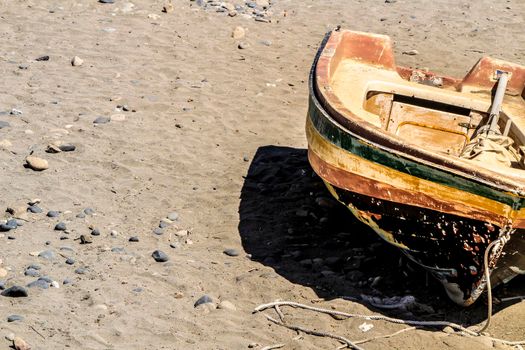 Old abandoned boat on the beach in Cabo de Gata, Almeria, Spain