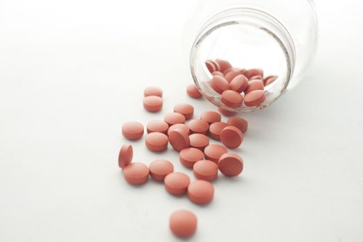 fever or pain relief medical pill on white background .
