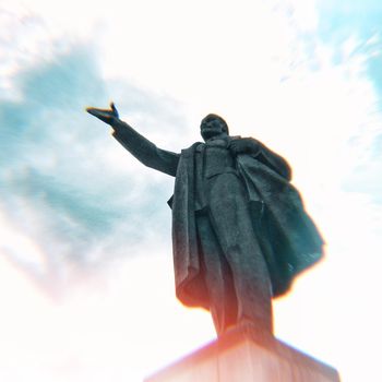 Statue of Vladimir Lenin in Russia with cloudy sky in background