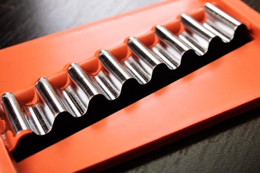 Grater for cutting vegetables on a wooden table