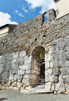 Ancient town of Ferentino , Italy , Porta Sanguinaria ,Blood Gate , best preserved gate of different historical periods ,round Roman arch , medieval wall above 