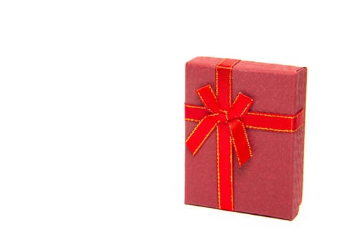 The gift box is red on a white background . New Year and Christmas, birthday. Gift. White background. Copy Space