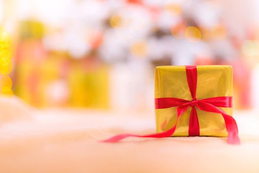 Golden gift banner . Copy space new year . Christmas. A gift for the holiday. The blur of the background. Article about the selection of gifts