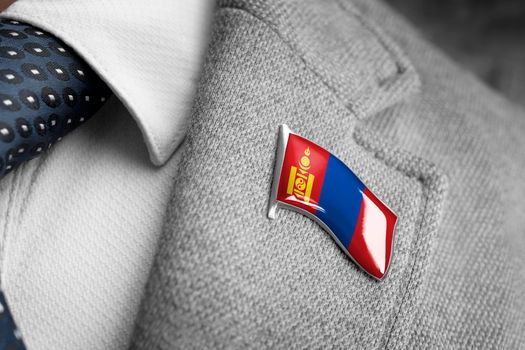 Metal badge with the flag of Mongolia on a suit lapel.