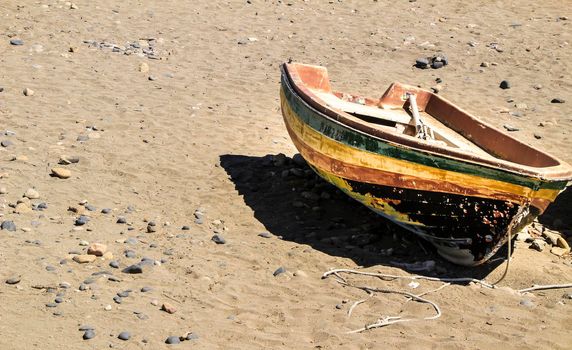 Old abandoned boat on the beach in Cabo de Gata, Almeria, Spain
