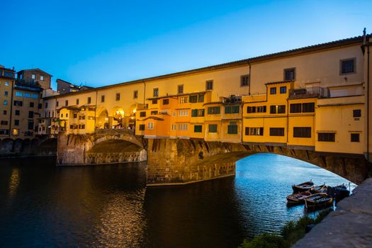 Florence, Italy - Circa June 2021: sunset on Ponte Vecchio - Old Bridge. Amazing blue light before the evening.