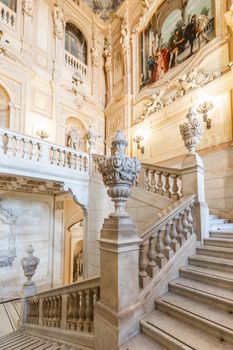 Turin, Italy - Circa August 2021: marble staircase in historic palace with luxury interior - Savoia Royal Palace