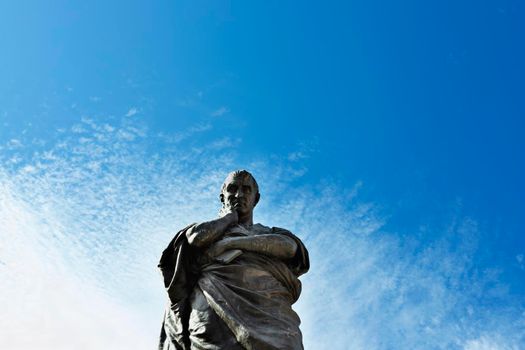 Bronze statue of the Roman poet Ovid against blue sky  symbol of the city of Sulmona, birthplace of Ovid