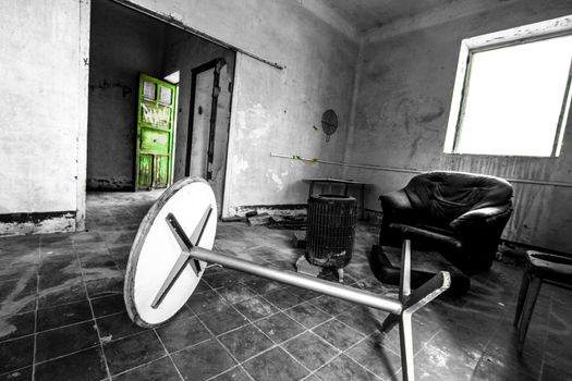 Abandoned house with broken furniture in the gold mines of Rodalquilar village in Almeria province, Spain.