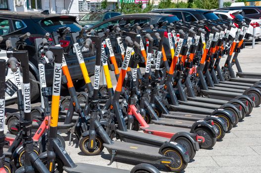 Krasnogorsk, Russia - July 22. 2021 The Short-term rental service for electric scooters Matur city