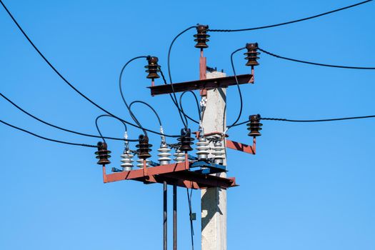 Overhead power transmission towers with the ceramic line insulators