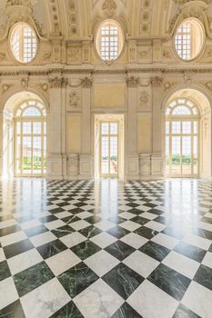 VENARIA REALE, ITALY - CIRCA MAY 2021: corridor with floor made of luxury marbles. Plenty of elegance for this Italian interior in Venaria Reale, Piedmont region.