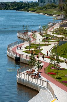 Krasnogorsk, Russia - July 22. 2021 Zhivopisnaya embankment on the Moscow River - a place of mass walks in Moscow suburbs