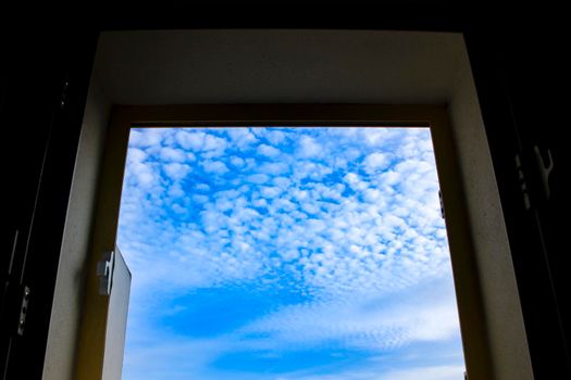 Altocumulus floccus sky through the window in Spain