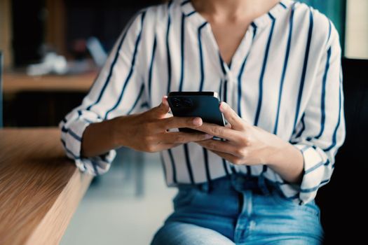 A businesswoman completes KYC using an online banking program in order to open a digital savings account. The definition of cyber security