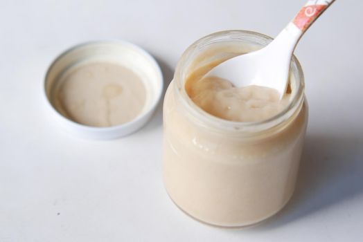 baby food in a container on table with copy space