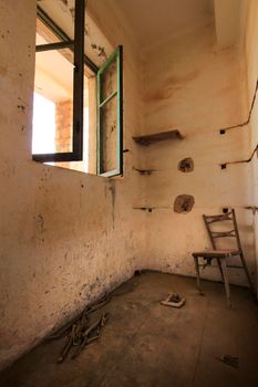 Green wooden window of old abandoned house in Spain.