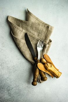 Festive place setting for holiday Christmas dinner on concrete table