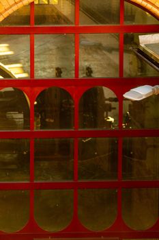 Big window with red frames of pumping station building