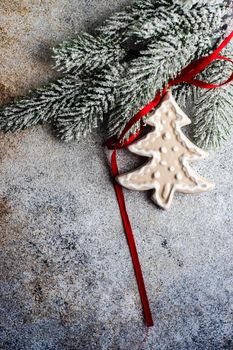 Christmas frame with ceramic gingerbread cookies on concrete background