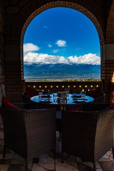 Served table for dinner with view to Great Caucasus mountain range in Kakheti, Georgia