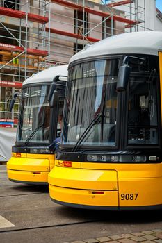 Tram terminal station. Modern trams are yellow. Berlin city transport. Berlin, Germany - 05.17.2019