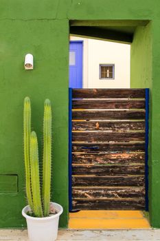 Green facade of house and beautiful cactus in Rodalquilar, Andalusia, Spain