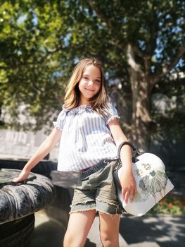 young model brunette walks the streets of Florida and posing for photos. High quality photo