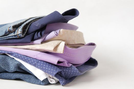 close up of stack of clothes on table
