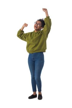 Black woman wearing casual clothes cheering with arms stretched screaming of joy full length portrait isolated over a white background