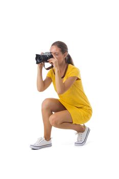 Woman photographer takes snaps, isolated on white background
