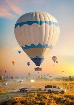Landing a hot air balloon on a trailer in the mountains of Cappadocia