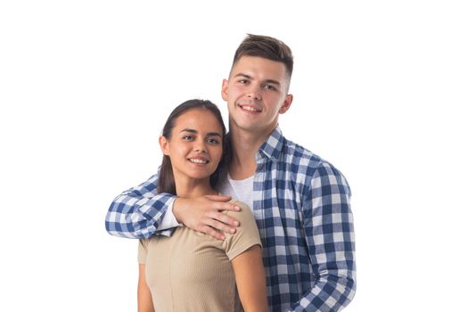 Portrait of a beautiful young happy smiling couple - isolated on white background