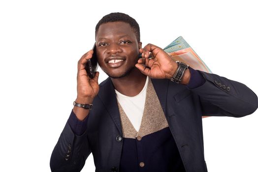 young man with shopping bags talking on smart phone isolated on white background