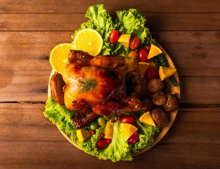 Thanksgiving roast turkey or chicken and vegetables, Top view Christmas dinner feast food decoration traditional homemade on wooden table background, Happy thanksgiving day of holiday concept