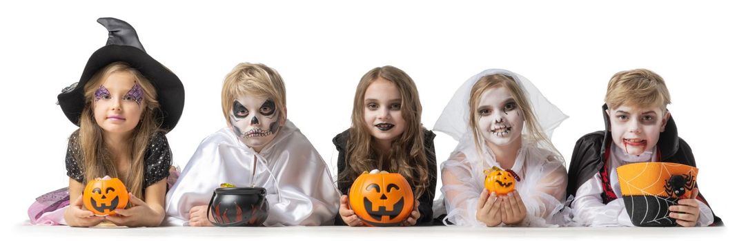 Group of children in fancy Halloween costume dress isolated on white background, going trick or treating